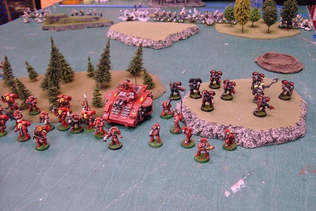 Space Marines of the Blood Angels chapter deploy against an army of traitorous scum